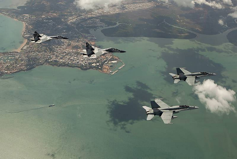 Two Australian No. 77 Squadron F/A-18 Hornet Aircraft welcome Indonesian Air Force (TNI AU) Sukhoi Su-30 & Su-27 Flanker aircraft into Darwin to participate in Exercise Pitch Black 2012.