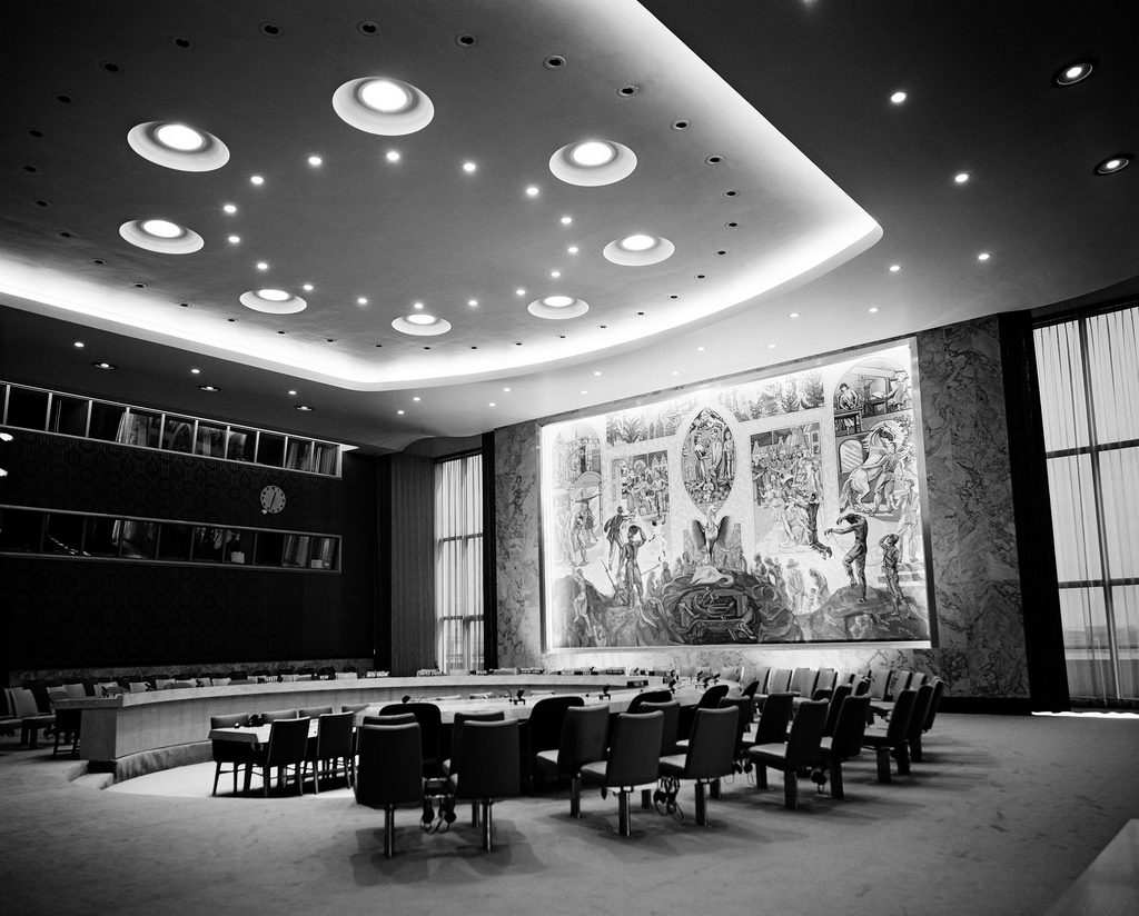 View of the Security Council chamber. This chamber, donated to the UN by Norway, was decorated by Arneberg with a mural by Per Krogh. Besides the delegates, each council chamber accommodates 400 visitors and 120 press correspondents. 