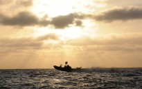 Sailors from a special boat team conduct boat operations supporting a SEAL team during their maritime operation training cycle
