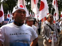 A demonstrator bares a shirt declaring the Senkaku/Diaoyu islands as Japanese territory. Nationalist group 'Ganbare Nippon' has seized on the issue as an example that Japan needs to enact a tougher foreign policy position towards China and its recent 'aggression'.