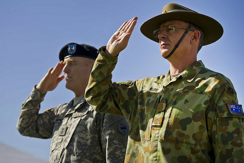Maj. Gen. Roger F. Mathews Deputy Commanding General U.S. Army, Pacific (USARPAC) and Australian Defense Force Maj. Gen. Richard M. Burr, Headquarters U.S. Army Pacific Deputy Commanding General of Operations salute as the US and Australian National Anthems are played during a Jan. 17, 2013 Deputy Commanding General flying V Ceremony at the Historic Palm Circle on Fort Shafter, Honolulu, Hawaii. The ceremony held to welcome Burr and his family as the first foreign military officer to be assigned at this level of leadership in the U.S. Army. Burr’s appointment as the USARPAC Deputy Commanding General of Operations signifies the continuing strong relationship between the United States and Australia and further shows the support by both countries for the National strategy of ensuring stability and security throughout the Pacific Region. (Department of Defense photo by U.S. Air Force Tech. Sgt. Michael R. Holzworth/Released)