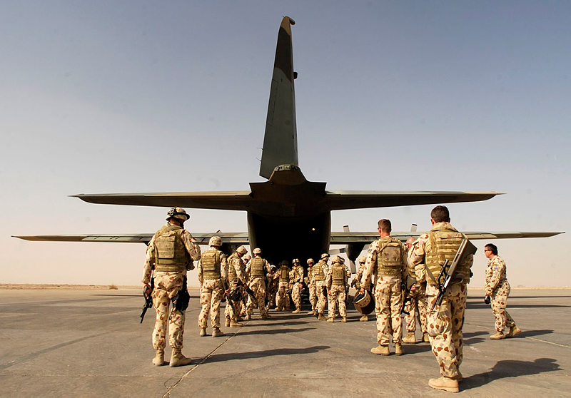 Soldiers from Combat Team Waler board the C-130 Hercules at Ali Air Base, Tallil Iraq for the first stage of their journey home to Australia.
