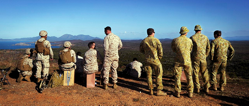 US Marines and Australian Army soldiers look out over the live fire range on Townshend Island during Exercise Talisman Sabre 2011.