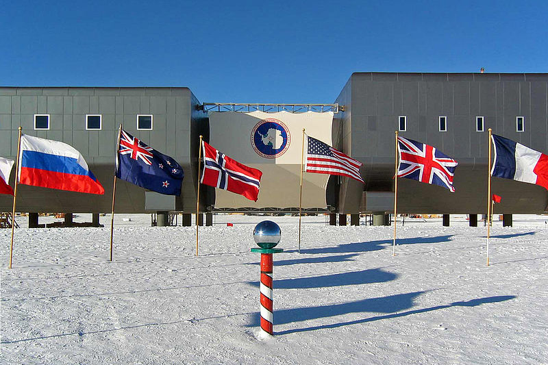  Amundsen-Scott South Pole Station in the 2007–2008 summer season. The new elevated Amundsen-Scott South Pole Station is now complete. In the foreground is the ceremonial South Pole and the flags for the original 12 signatory nations to Antarctic Treaty.
