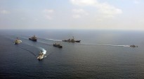 The Royal Malaysian Navy multi-role support ship KD Sri Indera Sakti, corvette KD Lekir and patrol vessel KD Handalan maneuver in formation with the amphibious dock landing ship USS Harpers Ferry (LSD 49) and the guided-missile destroyers USS Chafee (DDG 90) and USS Chung-Hoon (DDG 93) during a training exercise in the South China Sea, 2009.
