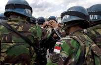 Indonesian peacekeepers with the United Nations Interim Force in Lebanon (UNIFIL) prepare to leave their base for a patrol near Al-Taybe, South Lebanon.