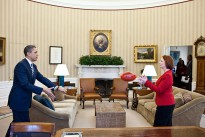 President Barack Obama practices passing a football with Prime Minister Julia Gillard of Australia in the Oval Office, March 7, 2011. Under Australian Football League rules, a player must hold the ball in front of them and punch it with a clenched fist in order to conduct a legal pass to another player. (Official White House Photo by Pete Souza)