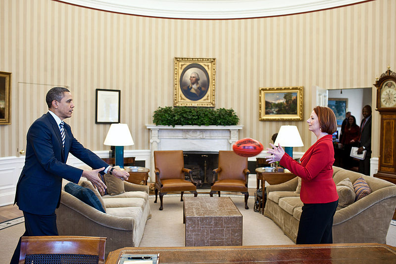  President Barack Obama practices passing a football with Prime Minister Julia Gillard of Australia in the Oval Office, March 7, 2011. Under Australian Football League rules, a player must hold the ball in front of them and punch it with a clenched fist in order to conduct a legal pass to another player. (Official White House Photo by Pete Souza)
