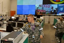 Navy Lieutenant Arthur Jagiello goes about his work in the Joint Control Centre of Headquarters Joint Operations Command (HQJOC), Bungendore.