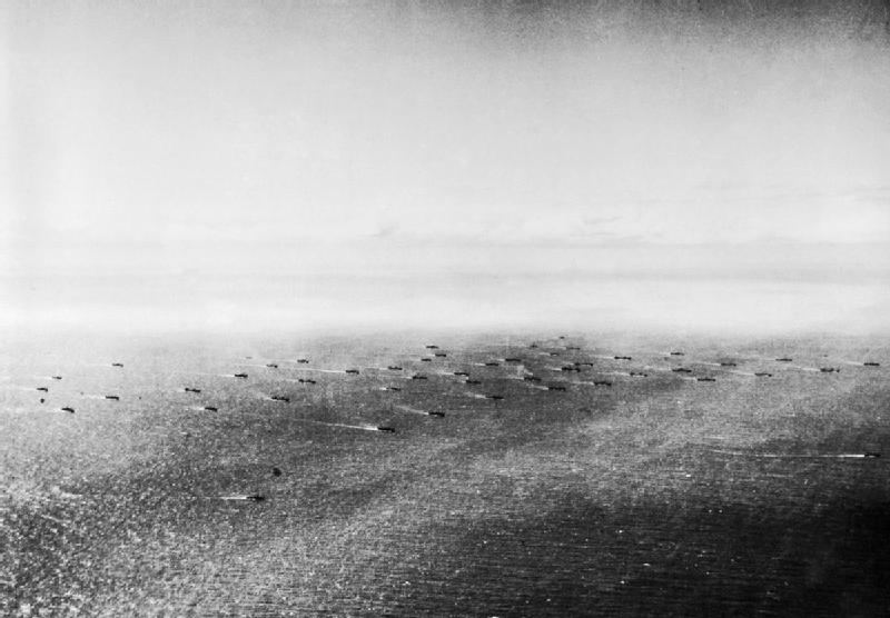 Caption: An aerial view of a convoy in the Atlantic, 1941. Two escorts can be seen in the foreground. (Photograph courtesy IWM)