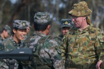 International teams enjoy some time together during Match 62 – International Service Rifle Championship on the last day of competition at this year's Australian Army Skill at Arms Meeting (AASAM). Warrant Officer Class Two Peter Richards of the Operations Support Squadron, 6th Engineer Support Regiment, jokes with shooting team members from China.