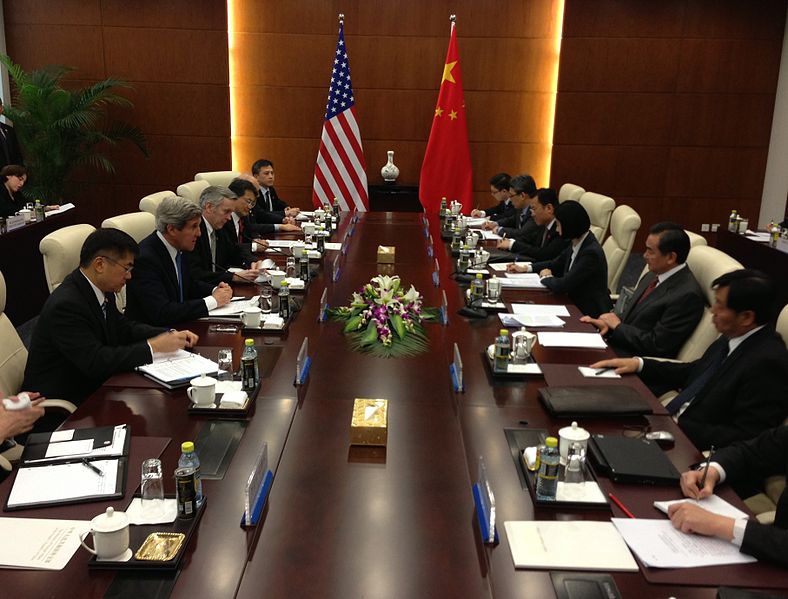U.S. Secretary of State John Kerry speaks with Chinese Foreign Minister Wang Yi at the beginning of a bilateral meeting in Beijing, China, on April 13, 2013. 