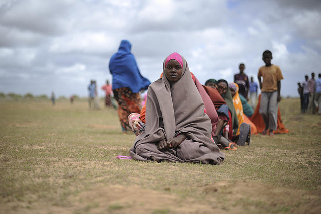 Women waiting for food aid at a distribution centre in Afgoye, Somalia. 