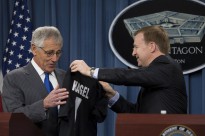 Secretary of Defense Chuck Hagel is presented a jersey for the New Zealand All Blacks Rugby team by New Zealand Minister of Defense Jonathan Coleman during a joint press conference in the Pentagon in Arlington, Va., on Oct. 28, 2013. Hagel and Coleman met earlier to discuss national and regional security items of interest to both nations. DoD photo by Erin Kirk-Cuomo. (Released)