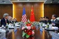 U.S. Secretary of State John Kerry and Chinese Foreign Minister Wang Yi sit across from one another at a meeting at the Ministry of Foreign Affairs in Beijing, China on February 14, 2014. [State Department photo/ Public Domain]