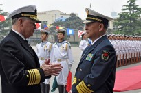 Chief of Naval Operations (CNO) Adm. Gary Roughead speaks with Adm. Wu Shengli, Commander-in-Chief of the People's Liberation Army Navy