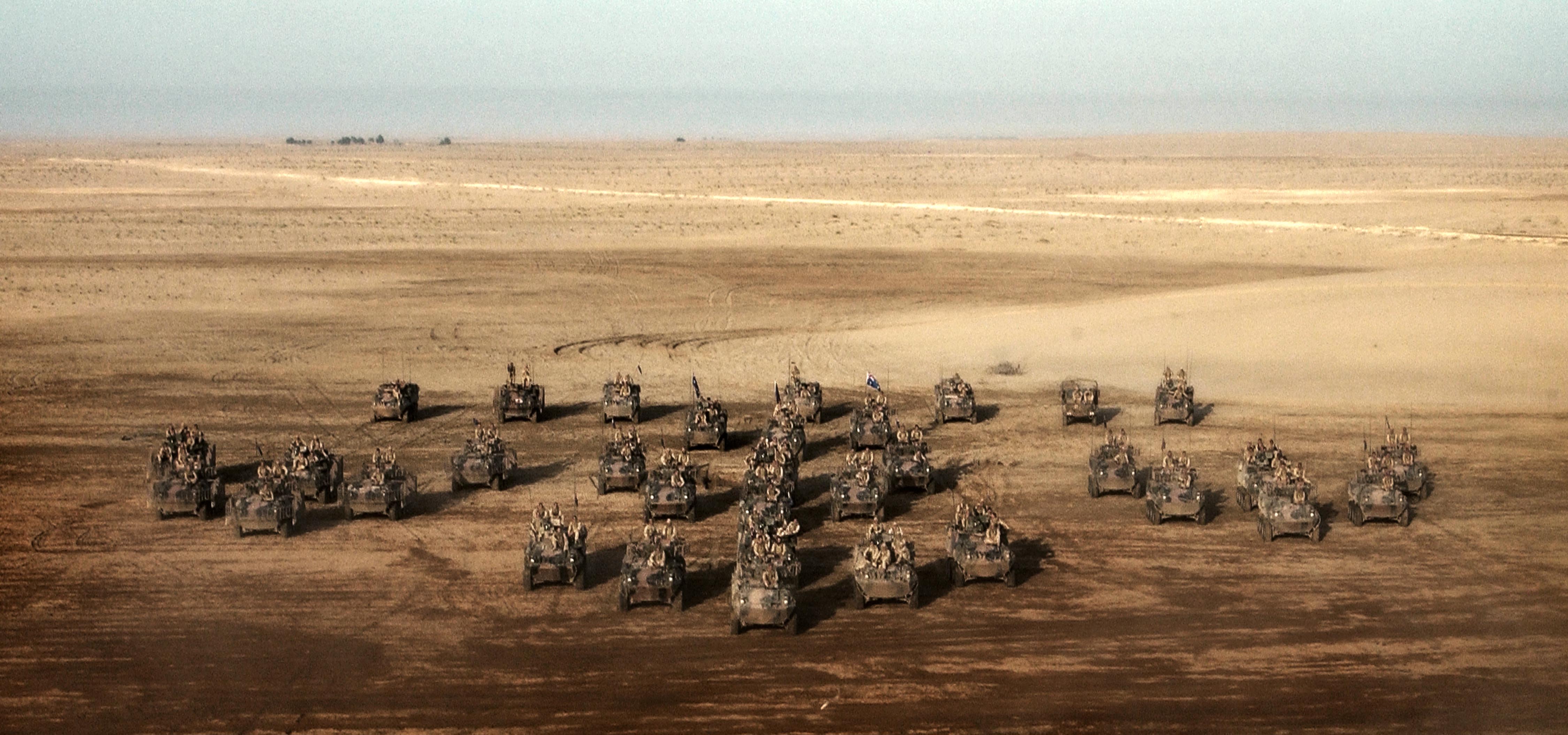 Australian Light Armoured Vehicles (ASLAVs) and support vehicles of Combat Team Courage, Al Muthanna Task Group, in southern Iraq.