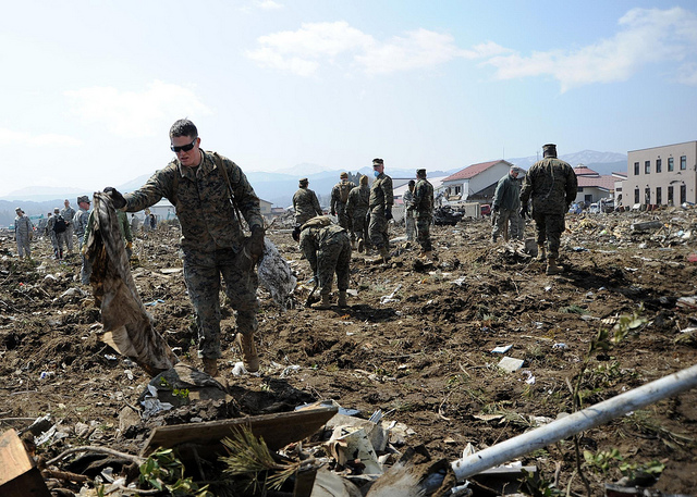 U.S. Marine Corps Lance Cpl. Garrett Williams, attached to a Combat Logistics Regiment 3, clears debris during Operation Tomodachi in Noda, Japan, April 1, 2011. More than 80 Sailors, Marines, Airmen and civilians from Misawa Air Base, Japan, participated in the cleanup operations. Operation Tomodachi was a multinational effort coordinated with Japan to respond to a magnitude 9.0 earthquake and a tsunami that struck northern Japan March 11, 2011. (U.S. Navy photo by Mass Communication Specialist 1st Class Matthew Bradley/Released)