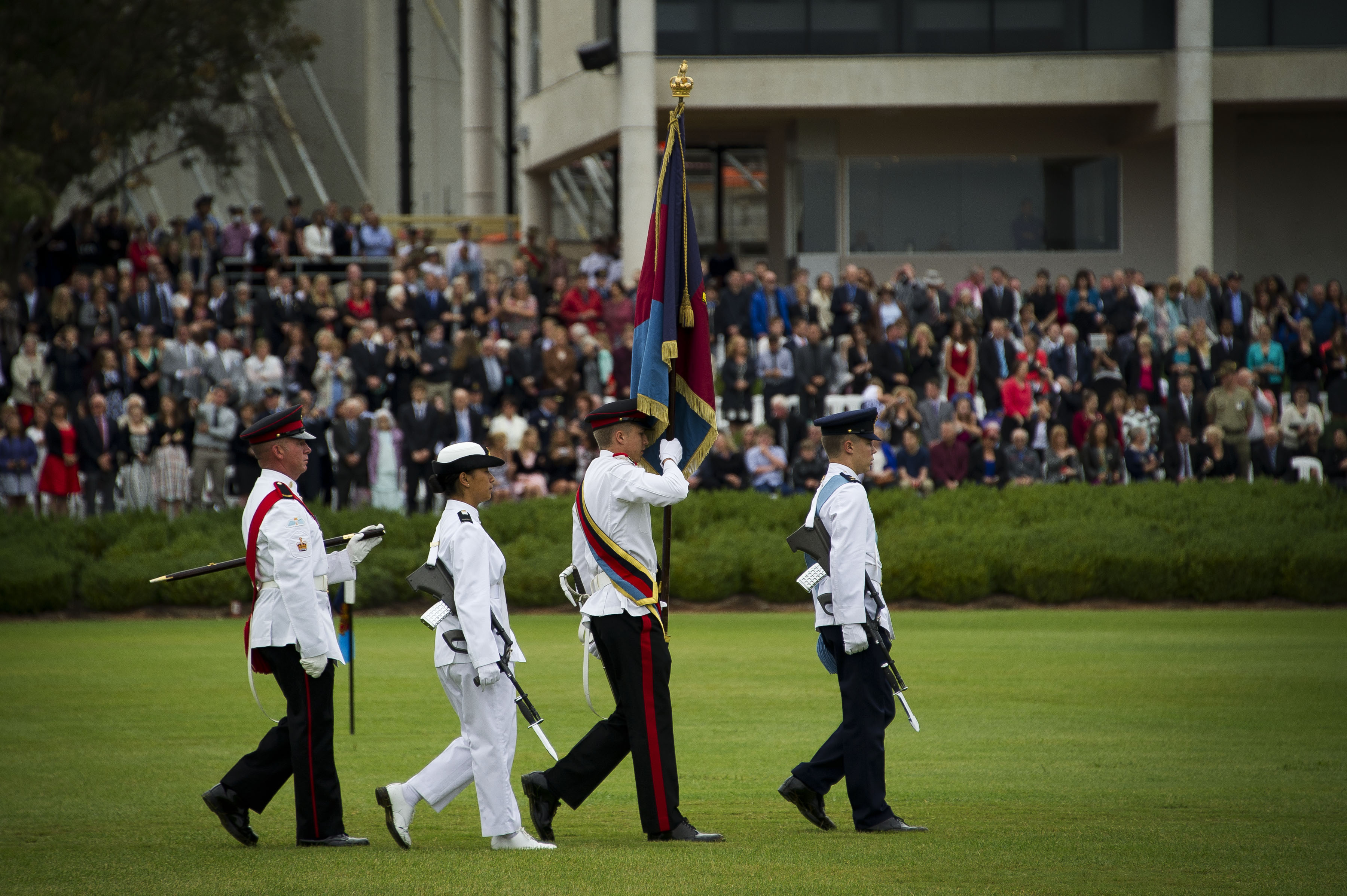 The Governor-General’s Banner is escorted by Australian Defence Force Academy midshipmen and officer cadets during the 2014 Chief of Defence Force Parade.