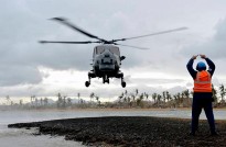 HMS Daring's Lynx helicopter arrives on the typhoon stricken Philippine island of Binuluanguan. Sailors from HMS Daring have continued their efforts to deliver aid to the victims of Typhoon Haiyan in the Philippines.