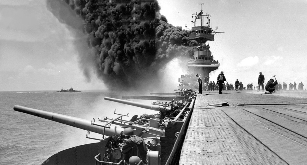 Damaged USS Yorktown (CV-5) and Astoria (CA-34) at Midway 1942.  Historically, the existential threats and serious risks to Australia have come by or over the sea. The maritime supremacy established by the US at Midway in 1942 has underpinned Australia's wellbeing for most of the last century.