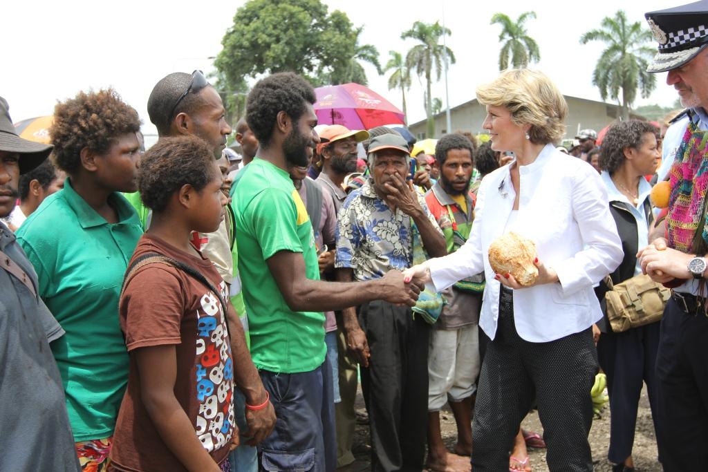 Minister for Foreign Affairs Julie Bishop greets vendors and customers at Lae Market, PNG, during a walking tour with officers from the AFP and the Royal Papua New Guinea Constabulary (RPNGC), who are working together to strengthen the RPNGC's ability to deliver effective and visible policing services for the people of PNG. 
