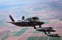 Three F-35B Lightning II Joint Strike Fighters with Marine Fighter Attack Squadron 121, 3rd Marine Aircraft Wing, fly in formation during fixed-wing aerial refuelling training over eastern California, Aug. 27, 2013.