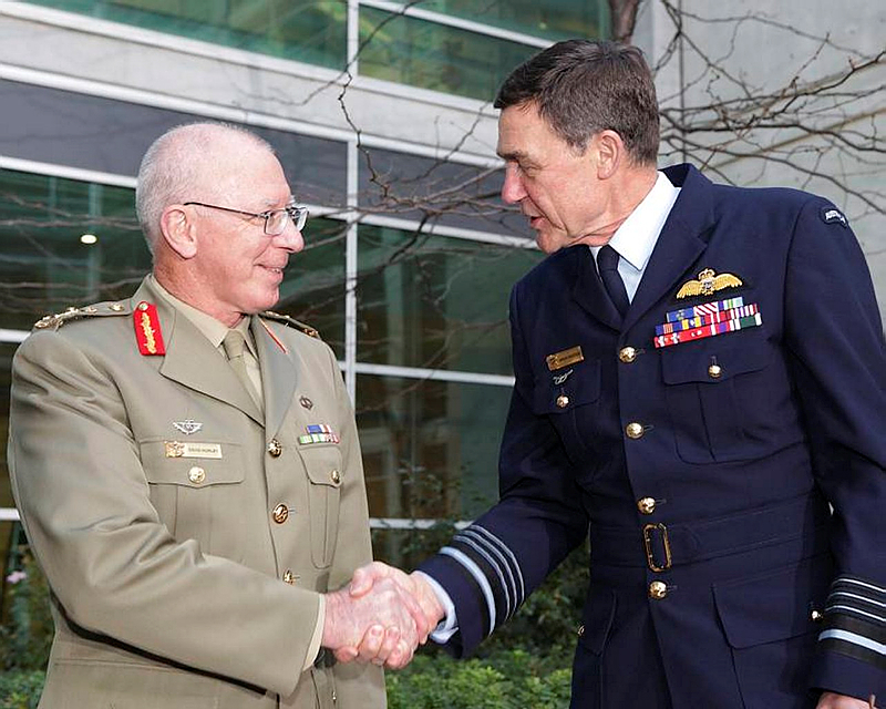 Newly promoted General David Hurley AC, DSC is congratulated by Air Chief Marshal Angus Houston AC, AFC on his promotion and transfer of authority as the new Chief of Defence on 1 July 2011. Over the nine years of their tenures, they served with five different Secretaries of Defence.