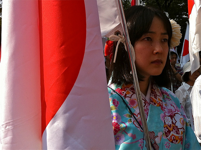 A Japanese woman in traditional dress participates in a protest regarding territorial claims to the Senkaku/Diaoyu Islands. Nationalism is increasing in Japan and is putting pressure on its pacifist constitution.