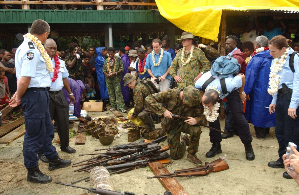 Regional Assistance Mission to Solomon Islands (RAMSI) military personnel destroy weapons at a ceremony at Marua, south east of Honiara on the last day of the Solomon Island gun amnesty on the 21 August 2003. The weapons at Marau were destroyed in front of hundreds of locals as well as representatives from RAMSI. 