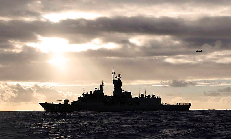 HMAS Perth transits through the Southern Indian Ocean as an Orion P-3K from the Royal New Zealand Air Force searches for debris as part of Operation SOUTHERN INDIAN OCEAN.
