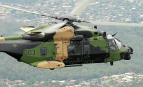 An Australian Multi-Role Helicopter (MRH 90) flies over Brisbane.