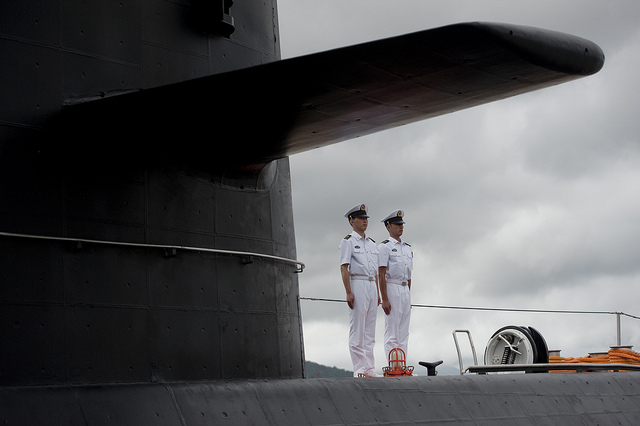 Chinese People's Liberation Army-Navy sailors stand watch on the submarine Yuan at the Zhoushan Naval Base in China on July 13, 2011. 