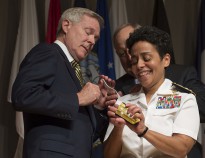WASHINGTON (July 1, 2014) Adm. Michelle Howard lends a hand to Secretary of the Navy (SECNAV) Ray Mabus as he and Wayne Cowles, Howard's husband, put four-star shoulder boards on Howard's service white uniform during her promotion ceremony at the Women in Military Service for America Memorial. Howard is the first woman to be promoted to the rank of admiral in the history of the Navy and will assume the duties and responsibilities as the 38th Vice Chief of Naval Operations from Adm. Mark Ferguson. (U.S. Navy photo by Chief Mass Communication Specialist Peter D. Lawlor/Released)
