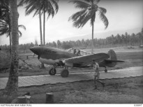 An RAAF P-40 Kittyhawk in PNG in WW2. By the time the strip at Nadzab was available in 1943 the USAAF was making use of more advanced aircraft.