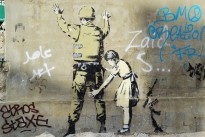 Banksy’s ‘Girl and a Soldier’, stencilled onto the wall of the West Bank in Bethlehem.