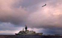 HMAS Perth transits through the Southern Indian Ocean as an Orion P-3K of the Royal New Zealand Air Force searches for debris as part of Operation SOUTHERN INDIAN OCEAN.