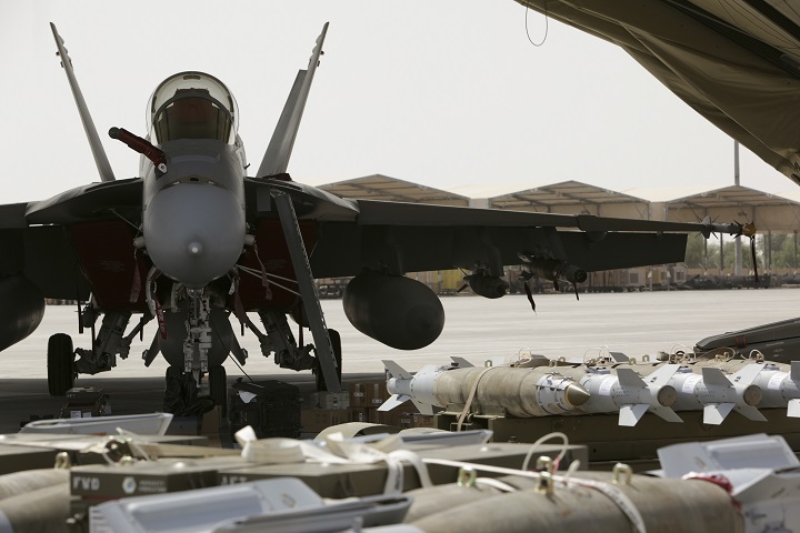 A Royal Australian Air Force  F/A-18F Super Hornet loaded with explosive ordnance  in the Middle East.