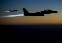 Two U.S. Air Force F-15E Strike Eagle aircraft fly over northern Iraq Sept. 23, 2014, after conducting airstrikes in Syria. The aircraft were part of a large coalition strike package that was the first to strike Islamic State of Iraq and the Levant (ISIL) targets in Syria. President Barack Obama authorized humanitarian aid deliveries to Iraq as well as targeted airstrikes to protect U.S. personnel from extremists known as ISIL. U.S. Central Command directed the operations. (DoD photo by Senior Airman Matthew Bruch, U.S. Air Force/Released)