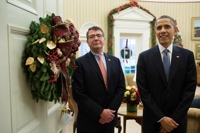 President Barack Obama and Ashton Carter wait in the Oval Office doorway before entering the Roosevelt Room where the President announced Carter's nomination for Defense Secretary, Dec. 5, 2014. (Official White House Photo by Pete Souza)