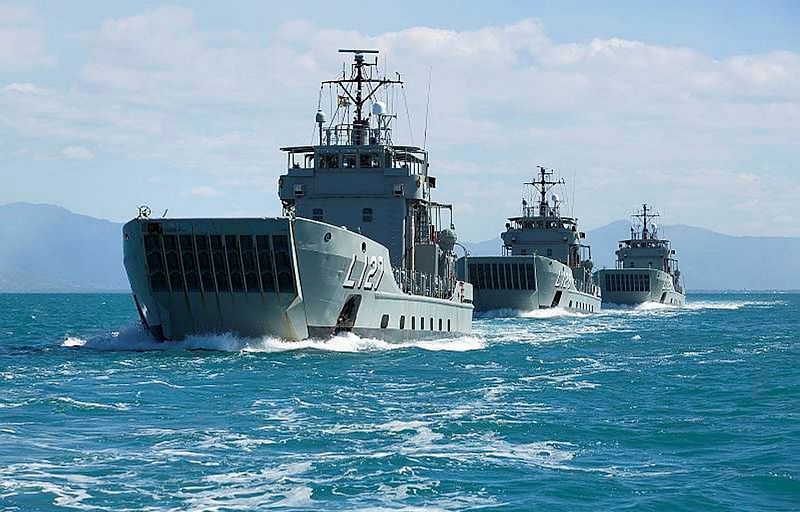 The Royal Australians Navy's Landing Craft Heavy (LCH) HMA Ships Brunei, Labuan and Tarakan depart Cairns Harbour in formation.