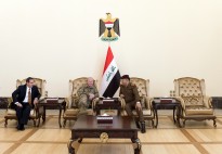 A senior Iraqi military officer waits with US Chairman of the Joint Chiefs of Staff, Gen. Martin E. Dempsey, and US Ambassador to Iraq, Stuart E. Jones, prior to a meeting with the Iraqi Prime Minister in Baghdad International Airport in Baghdad, Iraq, Mar. 9, 2015. (DOD photo by D. Myles Cullen/Released)