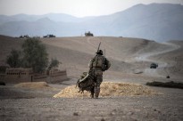 An Australian soldier from Mentoring Task Force – Three carries his pack near the town of Saghaytu after taking part in an Afghan National Army coordinated clearance of the Khod Valley, southern Afghanistan.