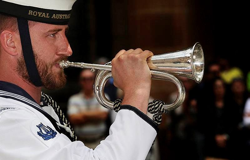 The Bugle player of the Royal Australian Navy Band, Sydney Detachment, plays the last post during the 72nd Anniversary Marking the loss of HMAS Sydney II, held at the Cenotaph, Martin Place, Sydney.