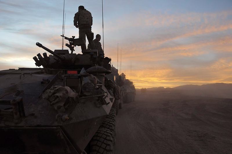 Soldiers from the 1st Mentoring and Reconstruction Task Force prepare to leave their base on a joint Australian and Dutch Patrol as the sunrises over Southern Afghanistan.