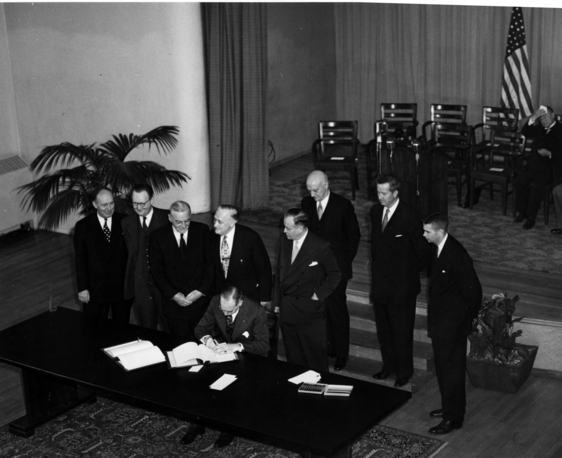 Secretary of State Dean Acheson is shown signing Tripartite Security Treaty (ANZUS)