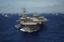 The Nimitz-class aircraft carrier USS Ronald Reagan (CVN 76) leads a mass formation of ships from Korea, Taiwan, Japan, Singapore, France, Canada, Australia and the United States through the Pacific Ocean July 24, 2010, during Rim of the Pacific (RIMPAC) 2010.