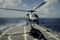 Royal Australian Navy Sea Hawk "Valkyrie" comes in to land on HMAS Darwin off the coast of Hawaii during RIMPAC 12.