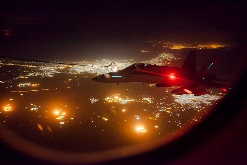 A coalition F/A-18 Hornet refuels from an RAAF KC-30A Multi Role Tanker Transport during an operational sortie.