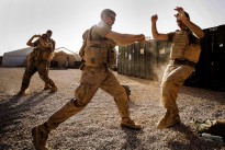 U.S. Marine Corps Lance Cpl. Ryan Turner, left, Combat Logistics Battalion (CLB) 22, 22nd Marine Expeditionary Unit, landing support specialist and native of Longcreek, S.C., counters a kick from Lance Cpl. Zack Jarvis, CLB-22 heavy equipment operator and native of Saint Peters, Mo., during martial arts training. The 22nd MEU is deployed with the Bataan Amphibious Ready Group as a theater reserve and crisis response force throughout U.S. Central Command and the U.S. 5th Fleet area of responsibility. (Marine Corps photo by Sgt. Austin Hazard/Released)